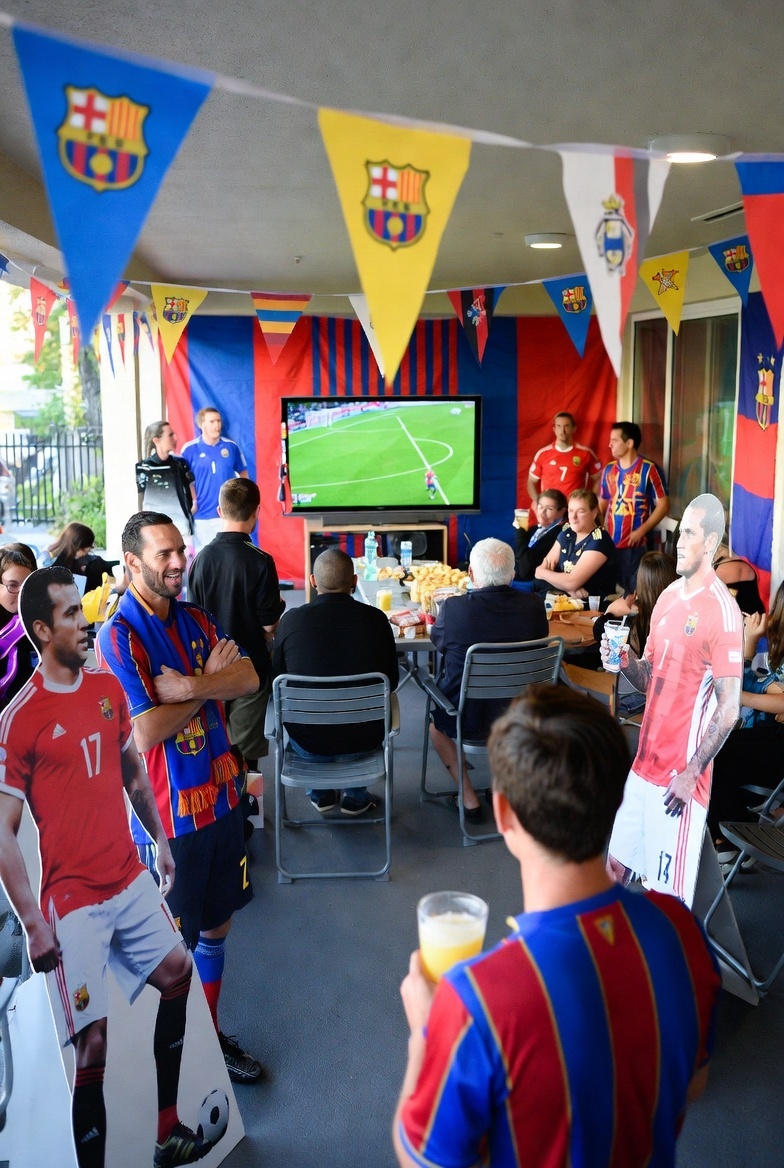 ively soccer watch party setup with multiple life-size player standups